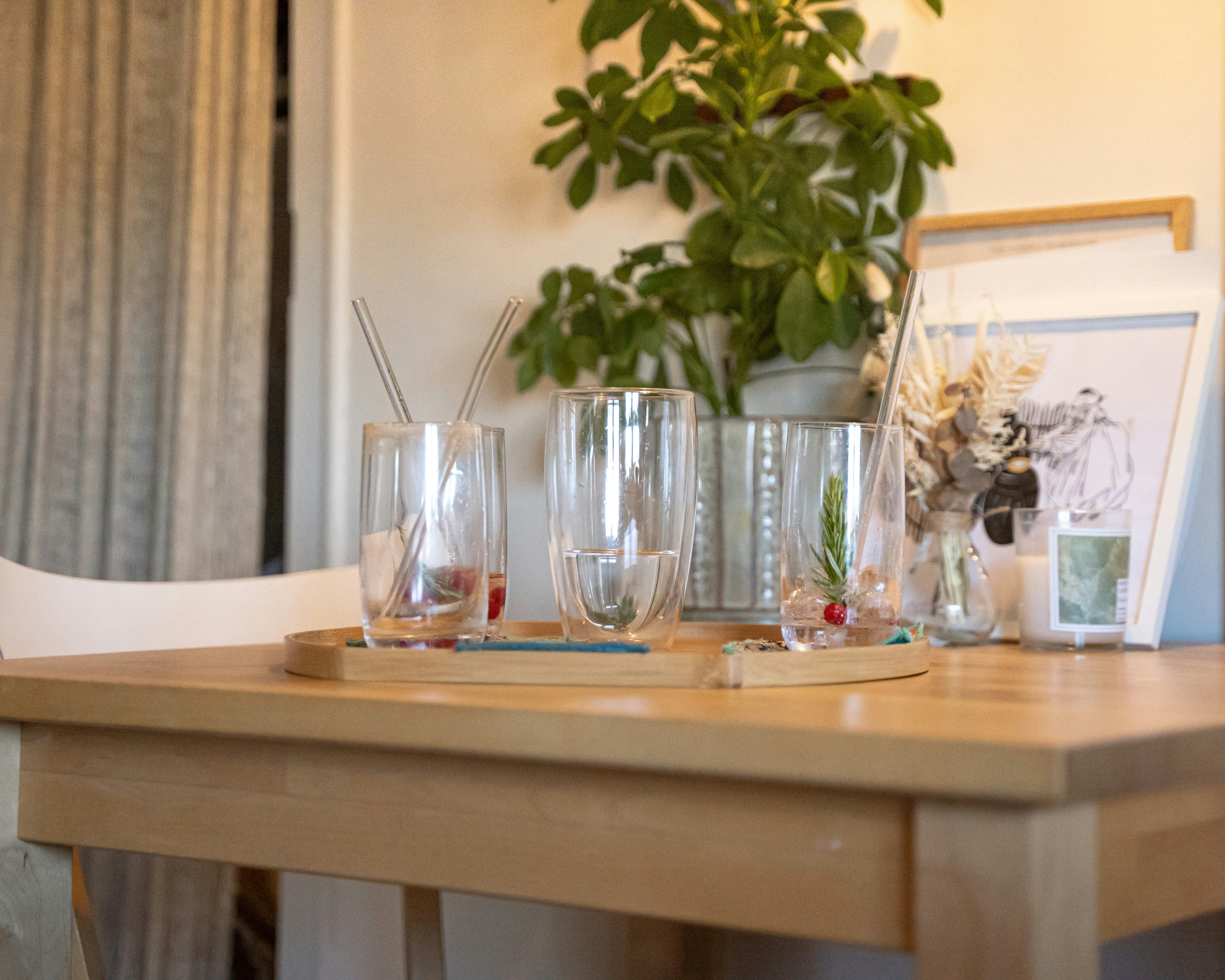 clear drinking glass on brown wooden table